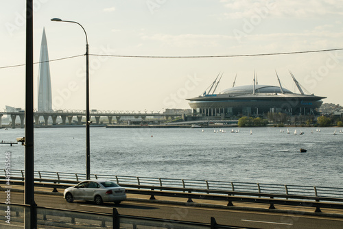 View from the window of the automobile western high-speed diameter, near the Zenit football arena, the Lakhta Center skyscraper, the Neva river, cars are driving over the bridge photo
