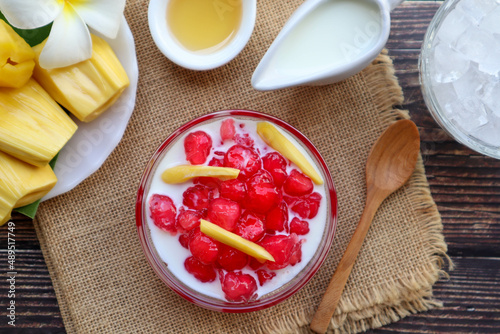 Thai Red Ruby dessert - made from water chestnut coated with flour served in syrup, jackfruits coconut milk and ice in Thai called 