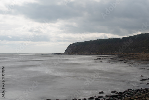 Long exposure photography of the sea at Kimmeridge Bay in Dorset, UK photo