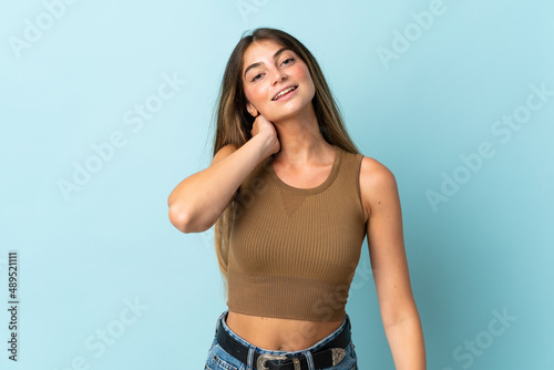 Young caucasian woman isolated on blue background laughing © luismolinero