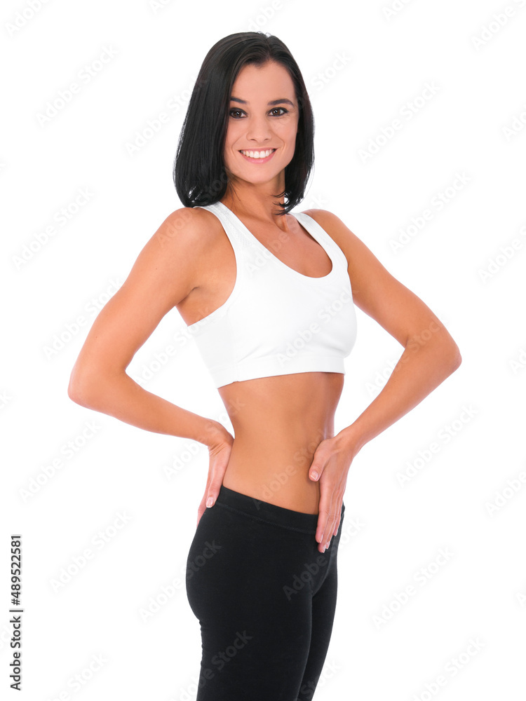 Feeling slim and trim. A young woman posed to show off her slender stomach. Feeling slim and trim. A young woman posed to show off her slender stomach.