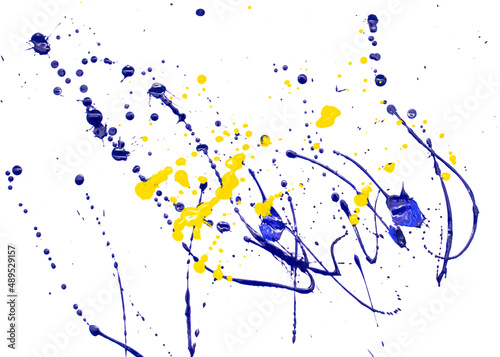 Fototapeta Naklejka Na Ścianę i Meble -  Drops of yellow and blue paint on a white paper background.