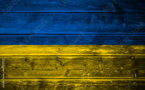 Background with flag of Ukraine on wooden boards