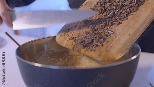 Hand mixing of chocolate dough in the bowl