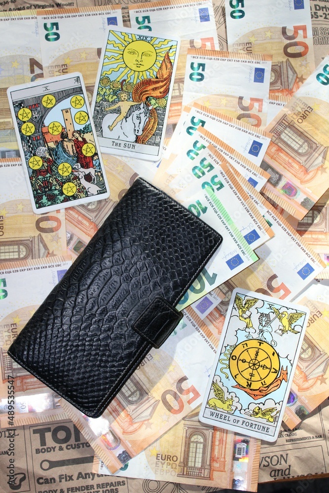 Euro banknotes, wallet  and Tarot cards 