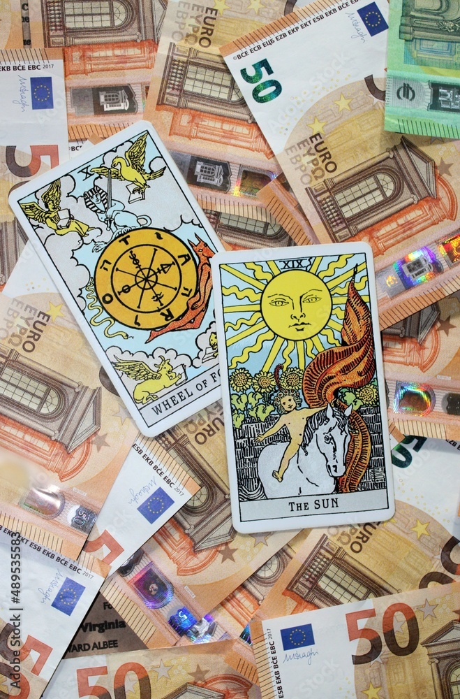 Euro banknotes and Tarot cards