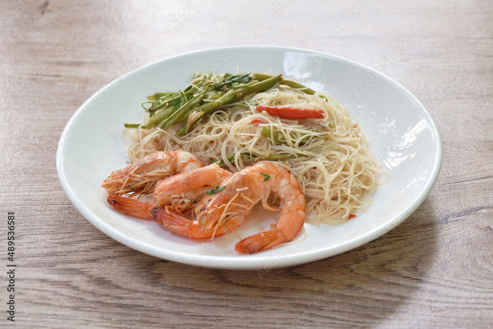 spicy fried rice vermicelli with shrimp and mimosa on plate spicy fried rice vermicelli with shrimp and mimosa on plate