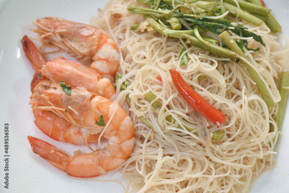 spicy fried rice vermicelli with shrimp and mimosa on plate spicy fried rice vermicelli with shrimp and mimosa on plate
