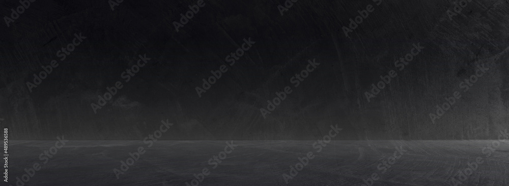Dark cement wall room studio background and rough floor concrete with soft light well editing montage display products and text present on empty free space backdrop