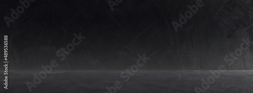 Dark cement wall room studio background and rough floor concrete with soft light well editing montage display products and text present on empty free space backdrop