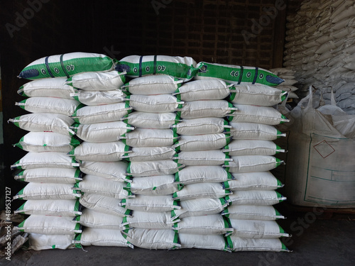 Chemical fertilizer Urea Stockpile white jumbo-bag Large ammonia nitrate in waiting for shipment is placed in the warehouse. Transport for farmers photo