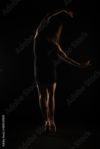 Asymmetrical pose on pointe shoes