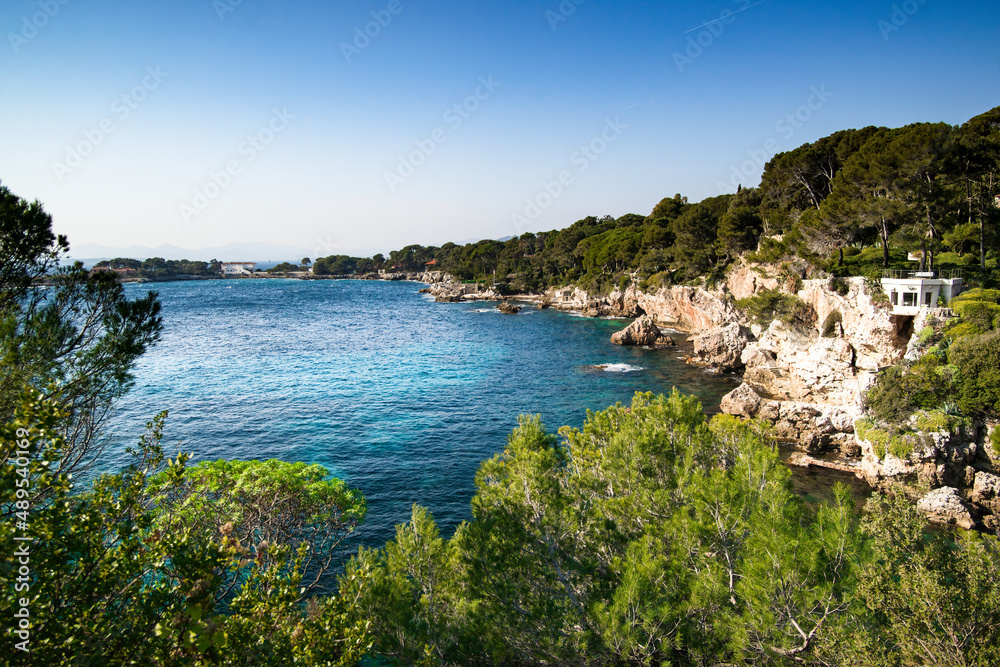 Blue mediterranean sea, and cliffs on the `Cap d'Antibes`, Antibes cape, French riviera , France, selective focus