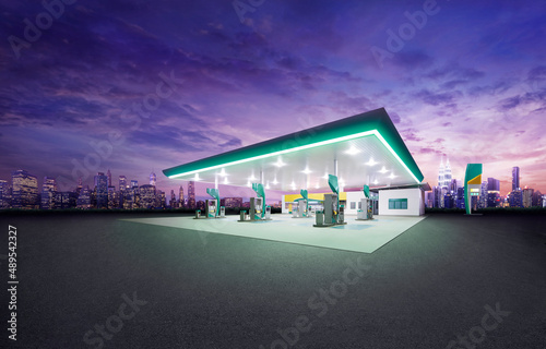 Fototapeta Petrol gas station at night with city building