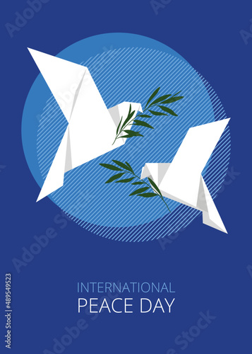Two white doves of peace are held by olive branches. A symbol of peace. Origami. Postcard for the international day of peace.