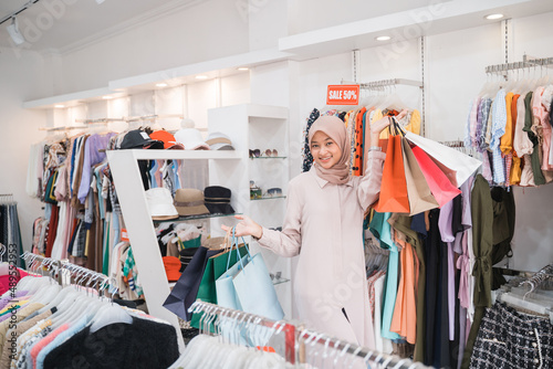 asian woman with hijab shopping in the fashion boutique store
