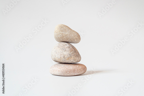Isolated on white background. Stack of white natural stone.your mind, your soul balancing, begging, meditation concept.