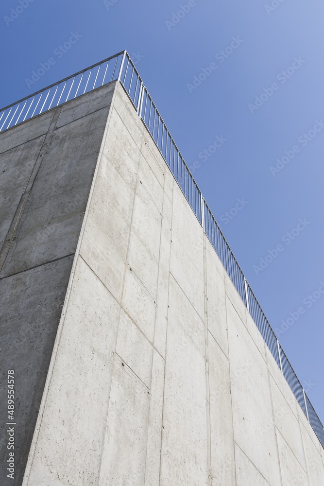 Detail of building facade. Beautiful sunny weather. Shadow play. Traditional building. Blue sky. Detail of building facade. Beautiful sunny weather. Shadow play. Traditional building. Blue sky.