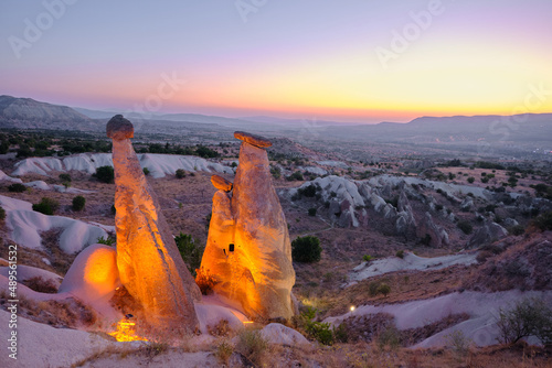 Geological shaped rock hoodoo and fairy chimneys during sunset at early in the morning and local name is uc guzeller area photo