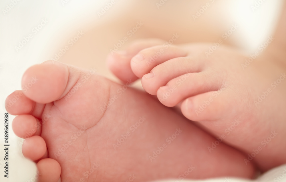 Soon these little feet will pitter-patter around the house. Cropped image of a babys feet. Soon these little feet will pitter-patter around the house. Cropped image of a babys feet.