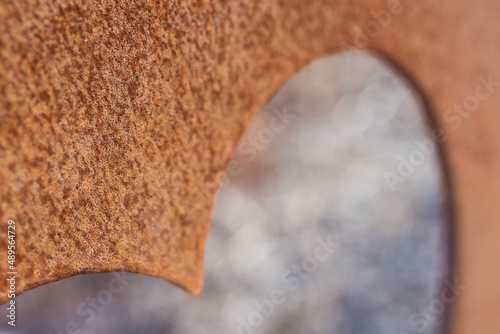 Rusting piece of iron in the shape of a heart, the vista bokeh racetrack stadium, love of sport