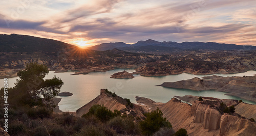 Landscape of a beautiful sunset on a lake. Librilla reservoir