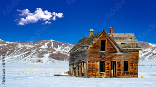 Rural abandon homestead in winter with blue sky above