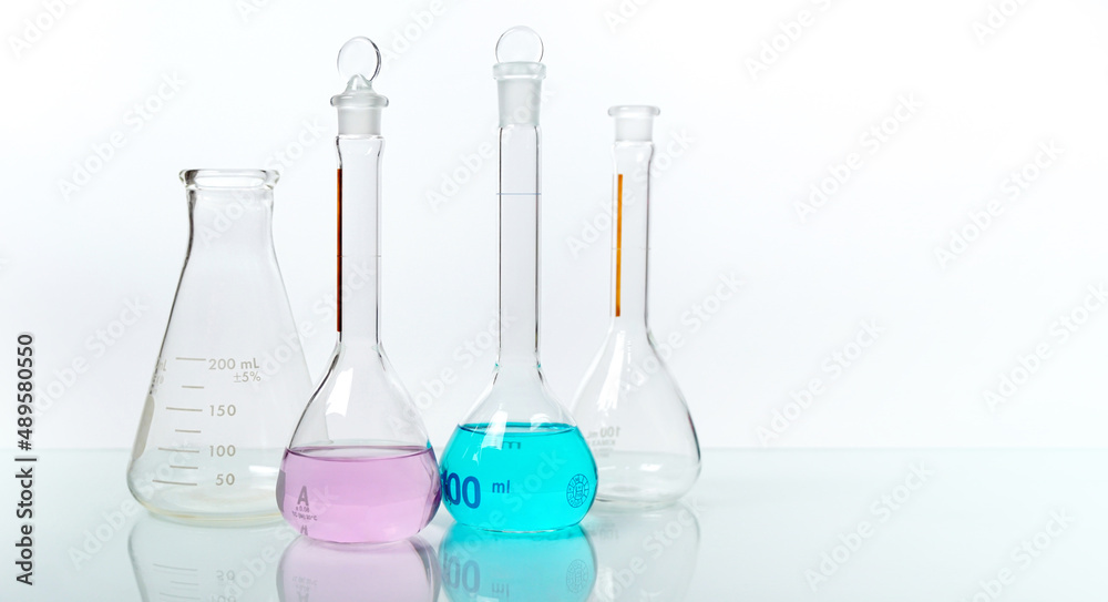 Science laboratory chemistry beakers, Erlenmeyer and round flask laboratory glassware concept research and development. biology and pharmaceutical industry concept. Science laboratory chemistry beakers, Erlenmeyer and round flask laboratory glassware concept research and development. biology and pharmaceutical industry concept.
