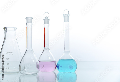 Science laboratory chemistry beakers, Erlenmeyer and round flask laboratory glassware concept research and development. biology and pharmaceutical industry concept.  © surasak