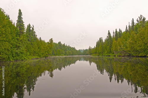 Calm Waters on a Misty Lake