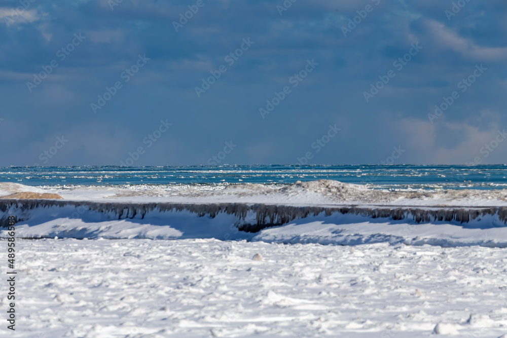 Lake Michigan shoreline and floating ice floes on the lake