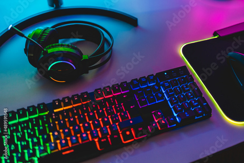 Gear equipment at gamer workspace - Rgb, keyboard, headphones and mouse
