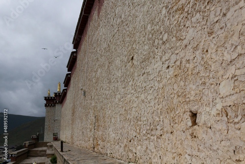 outside wall of the Ganden Sumtseling Gompa near Shangri-La, Yunnan, China