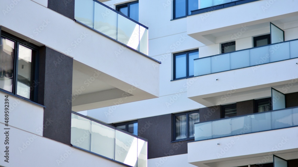 Fragment of modern residential apartment with flat buildings exterior. Detail of new luxury house and home complex. Fragment of modern residential apartment with flat buildings exterior. Detail of new luxury house and home complex.