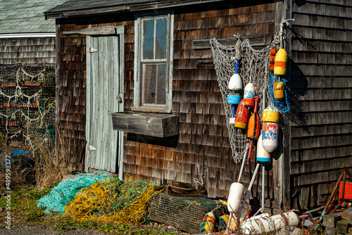 Fotografi A lobster fishing shack with colorful floats hanging in front