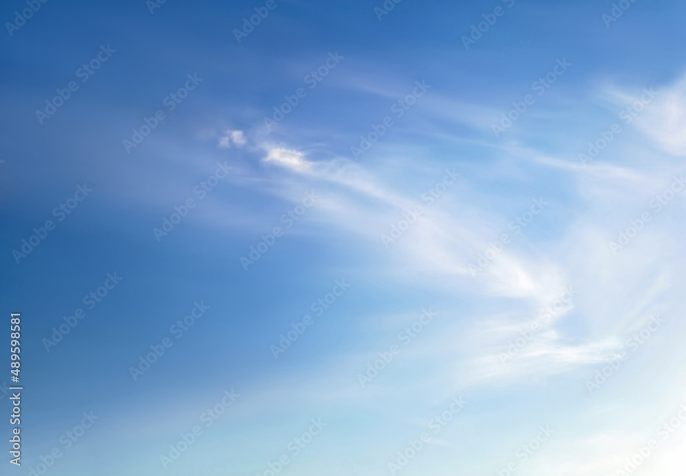 Blue sky with white fluffy cirrus clouds soft focus. Heavenly clouds background summer. Concept of freedom, relaxation, ecology. Copy space. Empty space for message..