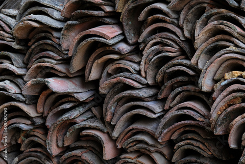Pile of old roof tiles waiting to be used