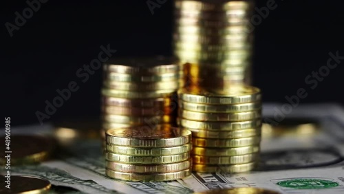A stack of gold coins isolated on a black background.Money on a black background.Finance and money.	
