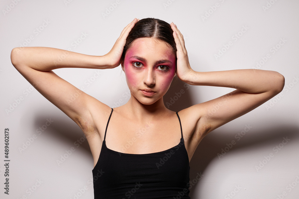 Young beautiful woman bright makeup posing fashion emotions cropped view unaltered Young beautiful woman bright makeup posing fashion emotions cropped view unaltered