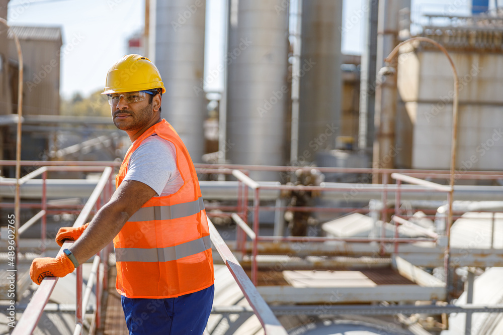 Experienced worker concentrating at his work in plant Experienced worker concentrating at his work in plant