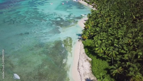 Aerial view of Saona Island in Dominican Republuc. Caribbean Sea with clear blue water and green palms. Tropical beach. The best beach in the world. photo