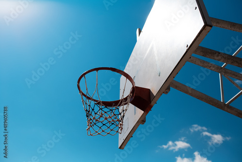 Basketball hoop in sunny day of spring.