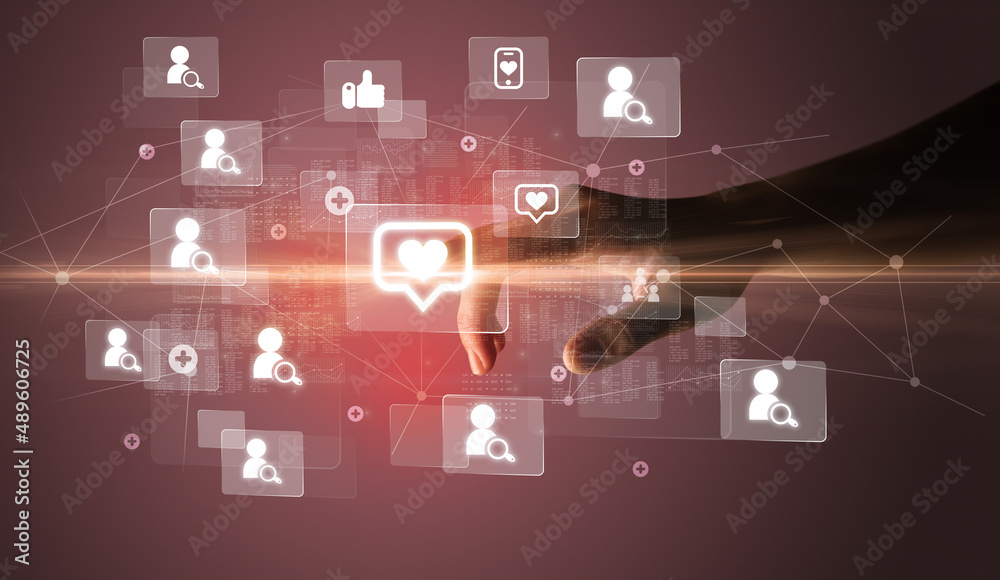 Hand pressing social media multimedia application screen with media icons on futuristic concept Hand pressing social media multimedia application screen with media icons on futuristic concept