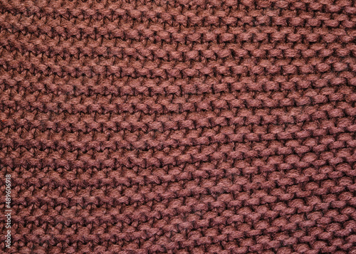 Texture knitted threads. Top view. Brown color.