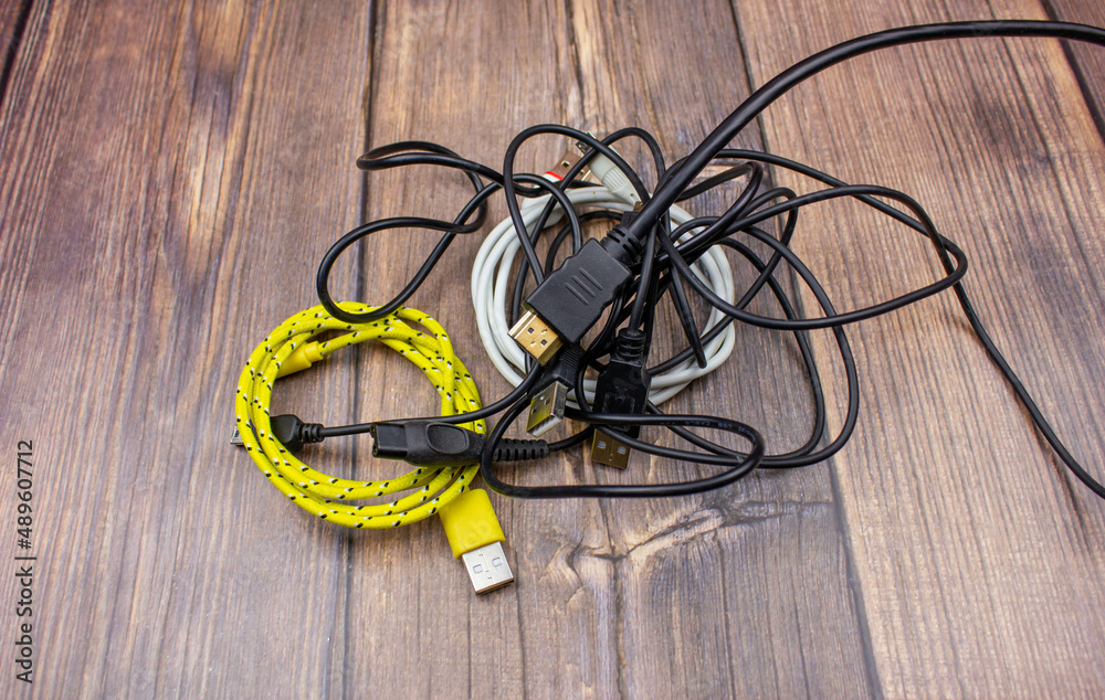 Wires close-up. A bundle of wires. Tangled wires. Miscellaneous wires are tangled. Wires close-up. A bundle of wires. Tangled wires. Miscellaneous wires are tangled.
