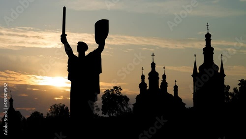 Pechersk Lavra Monastery and Motherland Monument in Kiev Skyline, Time Lapse at Sunrise with Colorful clouds,  Ukraine photo