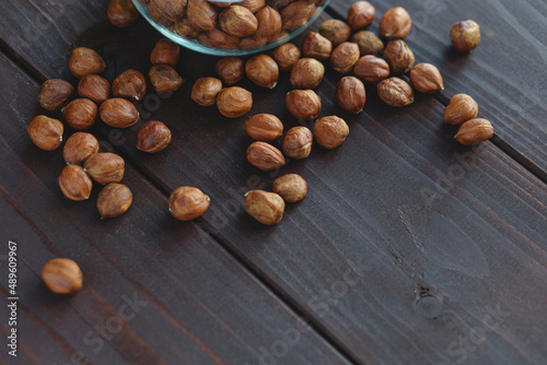 Close up brown hazel nut on wooden desk. Healthy organic snack hazelnut. Vegetarian nutrition.
