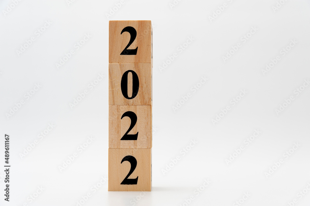 2022 written on wooden blocks in vertical direction isolated on white background with copy space 2022 written on wooden blocks in vertical direction isolated on white background with copy space