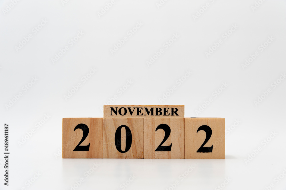 November 2022 written on wooden blocks isolated on white background with copy space November 2022 written on wooden blocks isolated on white background with copy space