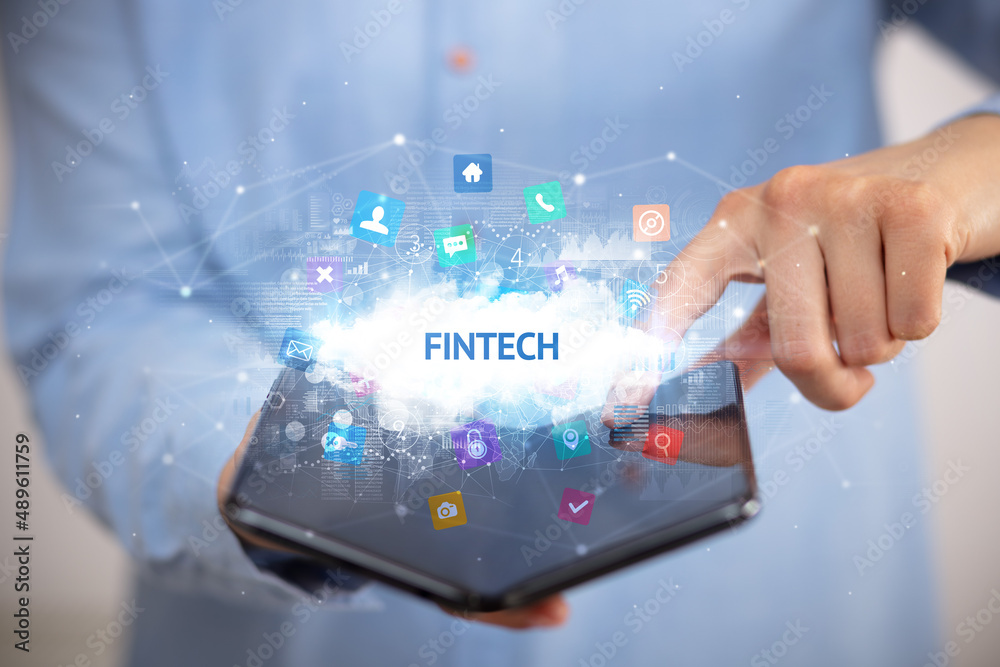 Businessman holding a foldable smartphone, technology concept Businessman holding a foldable smartphone, technology concept